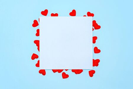 Abstract red wooden heart clip with Blank paper and stick paper on pastel blue background. paper note copy space for add text. education or valentine picture message background. minimal concept idea.の写真素材