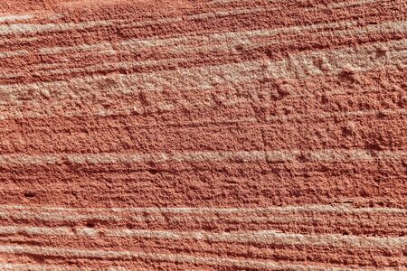 Orange stone wall outdoor background. Stone texture. Grunge