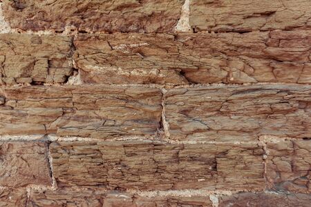 Brown brick wall outdoor background. Stone texture.の写真素材
