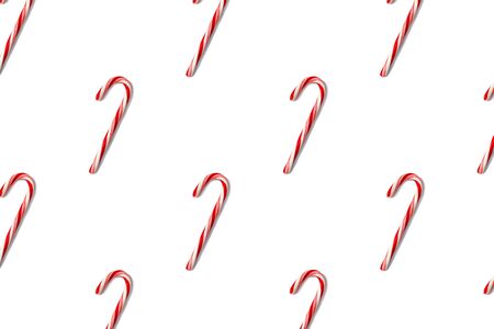 Candy canes pattern isolated on white, top view. Flat lay.の写真素材