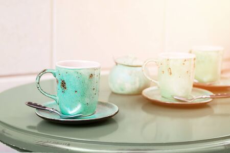 Green mint tea cups on table in cafe with copy space. Close up.の写真素材