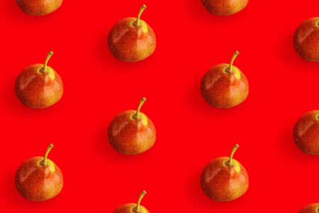 Creative pattern made of pears on red background.の写真素材