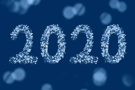 Blue stars sparkles shaped 2020 on dark background. Flatlay style, New Year concept.の写真素材