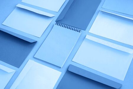 Correspondence envelops and notebook toned blue color, copy space.の写真素材