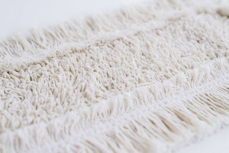 White fiber mop for cleaning floor isolated on white background. Top view.