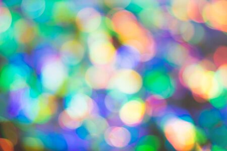 Delicate glitter bokeh rainbow background. Creative and moody color of the picture. Blurred texture.の写真素材