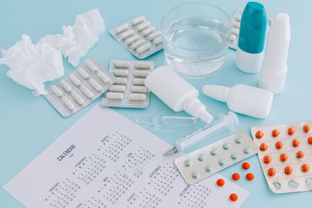 Set of pills and bottles of nose drops for treatment various viruses symptoms. Treatment of seasonal allergic rhinitis.の写真素材