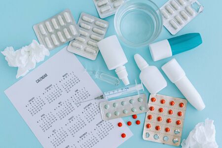 Set of pills and bottles of nose drops for treatment various viruses symptoms. Treatment of seasonal allergic rhinitis or flu. Healthcare concept.の写真素材