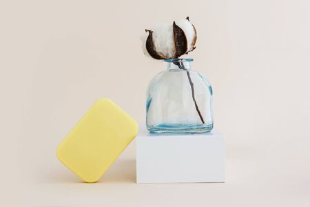 Soap and cotton flower. Minimal organic and zero waste cosmetics concept. Monochrome.の写真素材