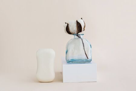 Soap and cotton flower. Minimal organic and zero waste cosmetics concept. Monochrome.の写真素材