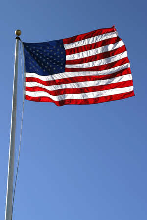 American flag in strong breeze.