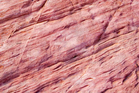 Detail of red sandstone showing its texture.の写真素材