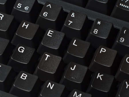 Black keyboard with the letters spelling help.の写真素材