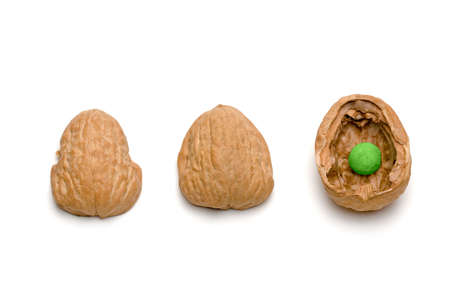 A traditional shell game with three walnut shells