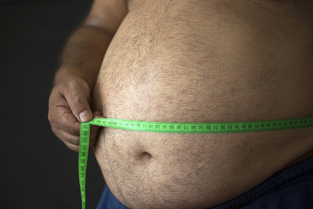 fat man with a measuring tape