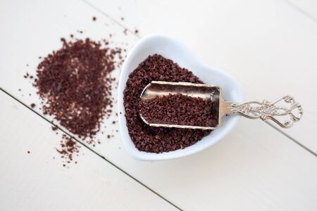 sumac powder on white wooden backgroundの写真素材