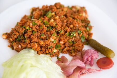 Turkish Traditional Bulgur Salad Kisir and pickled vegetablesの写真素材