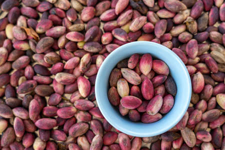 background of fresh pistachio nutsの写真素材