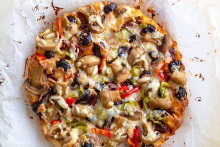 homemade pizza on parchment paperの写真素材