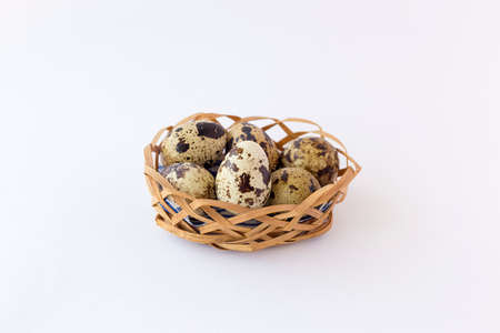 quail eggs in a basketの写真素材