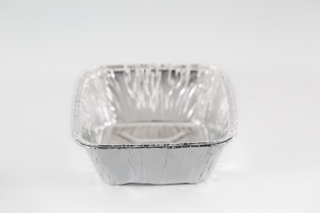 aluminum foil bowl on white backgroundの写真素材
