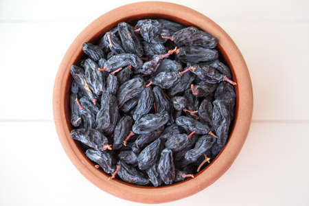 black raisins in a bowl
