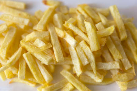 chips (french fries) in white dish