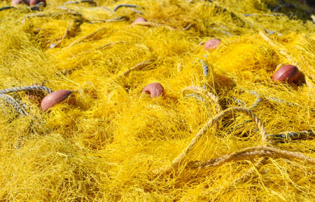Yellow texture of fishing net. Summer inspiration for active holiday.の写真素材