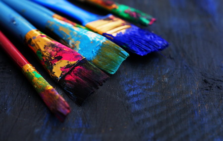 paint brushes in dark backgroundの写真素材