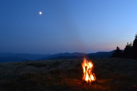 forest fire in mountains against the moonの写真素材