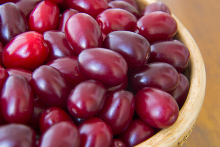 Ripe berries of dogwood in a bowl close up