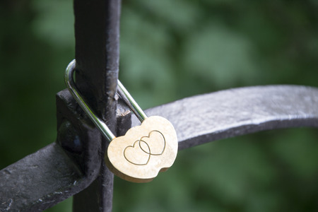 Lock of love, hanging on the railing of the bridgeの写真素材