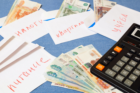 Russian money laid out in envelopes.The distribution of the family budget.の写真素材