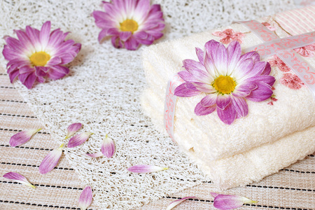 Hotel towel. Two towels and flowers of chrysanthemums.の写真素材