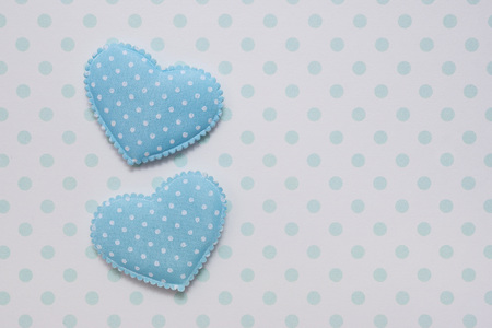 Valentine's Day. Congratulatory background.Two blue hearts on a background of polka dots.の写真素材