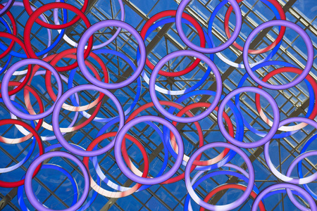 Abstract background of lamps. Modern lamps in the form of rings under a glass ceiling