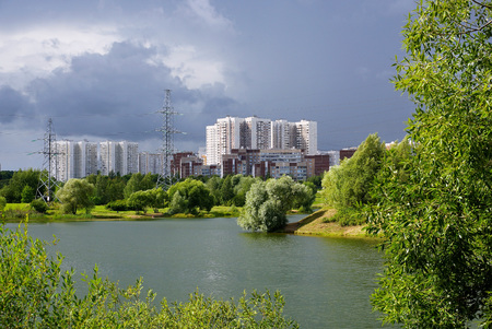 MOSCOW, RUSSIA - AUGUST 1, 2015. View of the Mitino district in Moscow and a pond in a landscape park.のeditorial素材