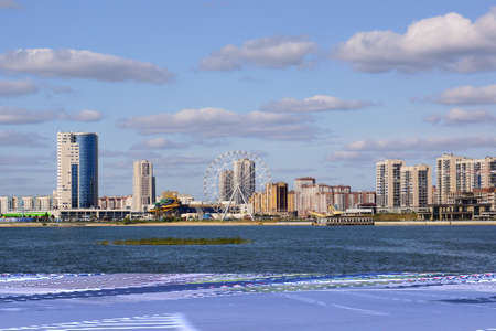 Kazan, Russia - September 2, 2019. View of the Novo-Savinovsky district. Water park and ferris wheel. Embankment of the Kazanka Riverのeditorial素材