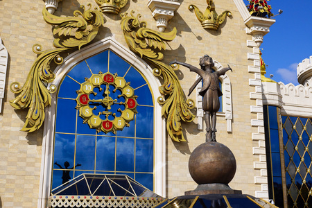 Kazan, Russia - September 3, 2019. Tatar State Puppet Theater "Ekiyat". Fragment of the facade with a clock and a sculpture of a little prince.のeditorial素材