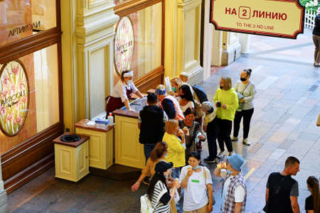 Moscow, Russia - August 3, 2021. Sale of ice cream in GUM. Department Store Customers Snapping Up...