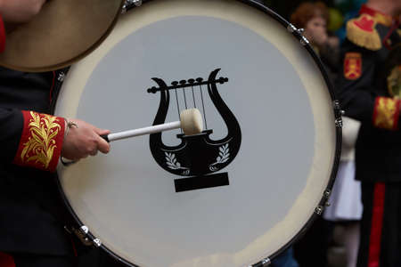 Detail of a Bass drum in a parade by the streets of a townの写真素材