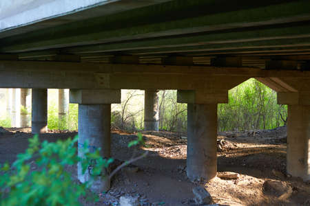 stone columns under a bridge