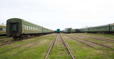 Old Abandoned train carriages in a decaying depot