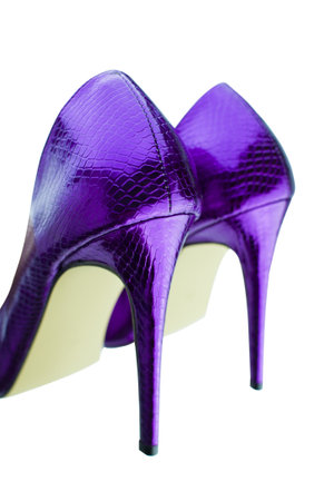 Close up of purple high heels on white background.の写真素材