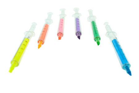 Multi Colored highlighters in the form of a syringe isolated on white background.の写真素材