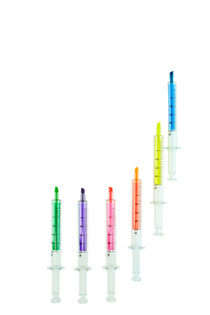 Multi Colored highlighters in the form of a syringe isolated on white background.