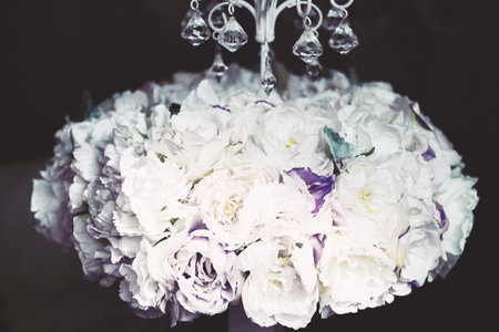 Fluffy dark purple peonies flowers. Creative bouquet in vintage.の写真素材