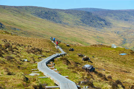 Group of hikers on mountains Glendalough at early spring.のeditorial素材