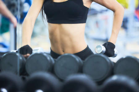 Fitness woman in training. Strong abs showing.の写真素材