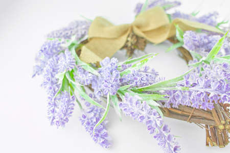 Lavender wreath heart-shaped isolated on white background.の写真素材